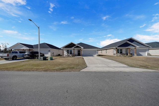 single story home with a front lawn and a garage