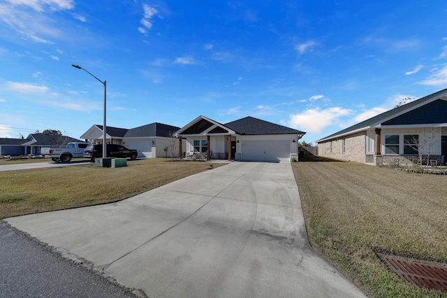 ranch-style home with a garage and a front lawn