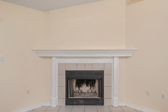 details featuring a fireplace and baseboards