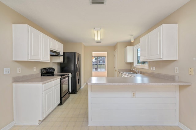 kitchen with light floors, light countertops, a sink, under cabinet range hood, and black appliances