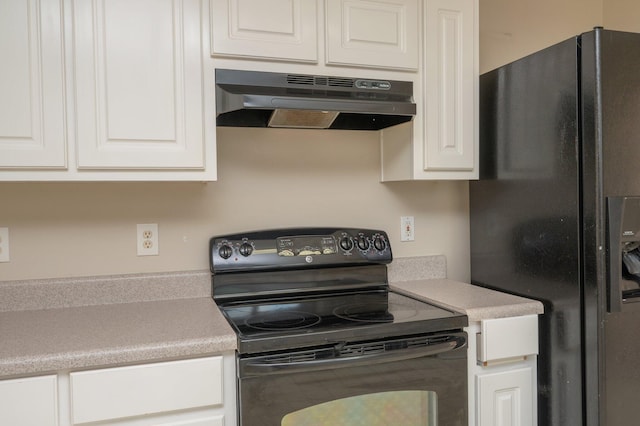 kitchen with black appliances, under cabinet range hood, white cabinetry, and light countertops