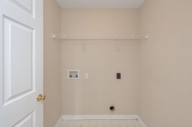 clothes washing area featuring laundry area, washer hookup, baseboards, tile patterned floors, and electric dryer hookup