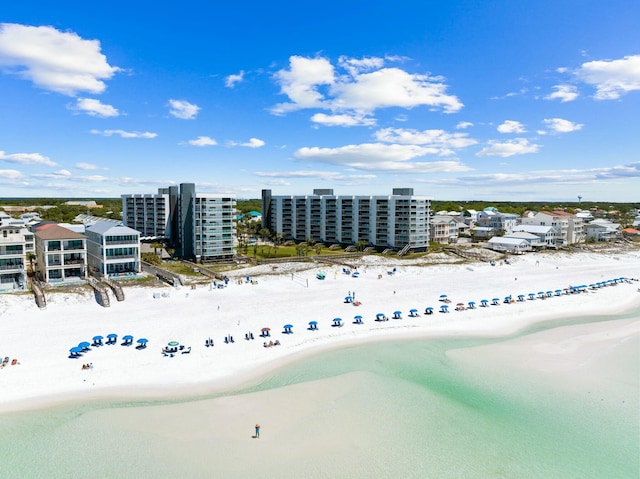 bird's eye view with a water view and a view of the beach