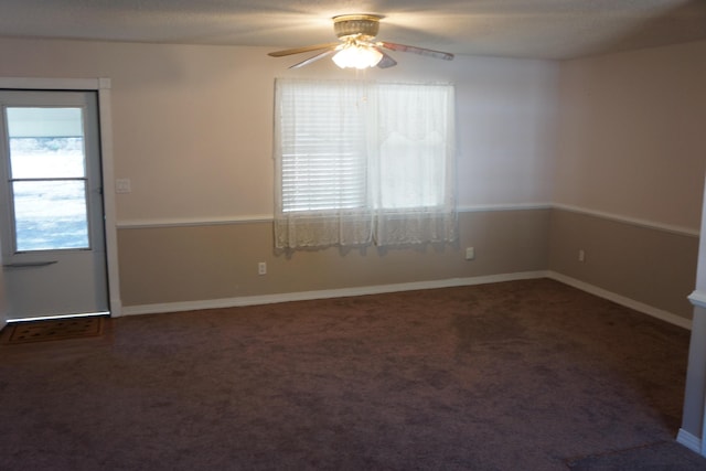 carpeted empty room with ceiling fan