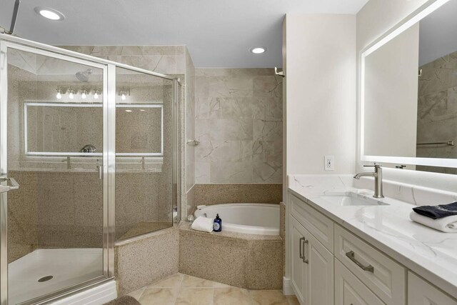 bathroom with vanity, tile patterned floors, and separate shower and tub