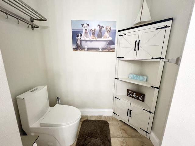 bathroom featuring tile patterned floors and toilet