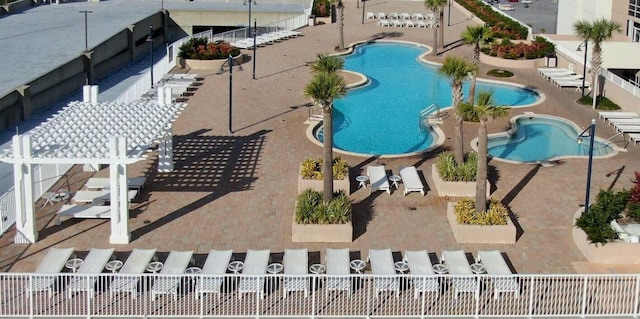 view of swimming pool with a patio