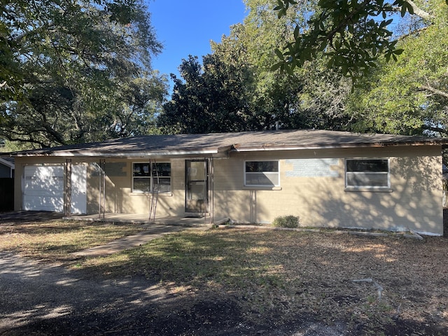 single story home featuring a garage