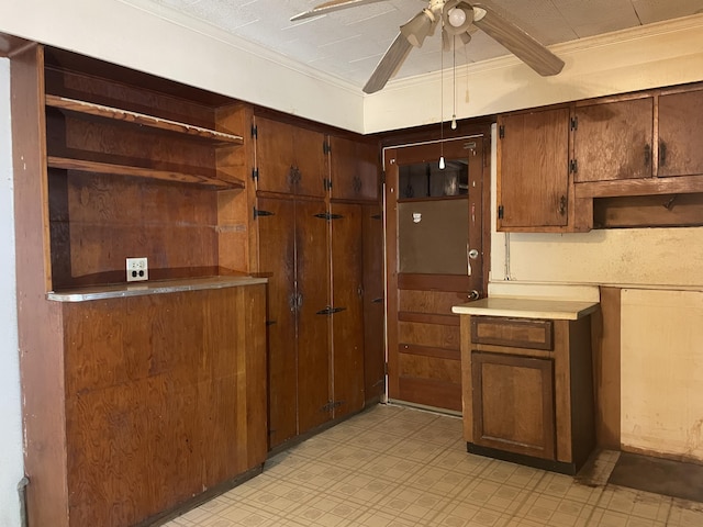 kitchen featuring ceiling fan and ornamental molding