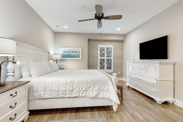 bedroom featuring ceiling fan and light hardwood / wood-style floors