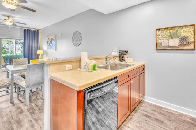 kitchen featuring ceiling fan, light hardwood / wood-style floors, kitchen peninsula, sink, and black dishwasher