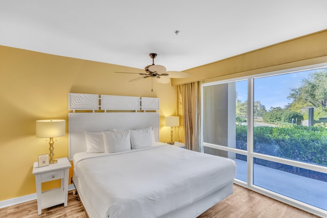 bedroom with ceiling fan, access to exterior, and light hardwood / wood-style flooring