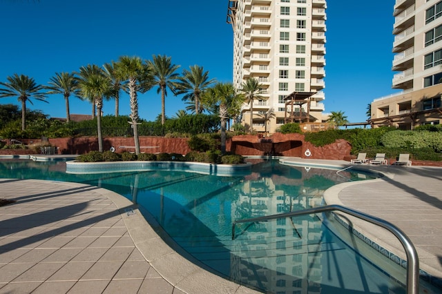 view of swimming pool featuring a patio area