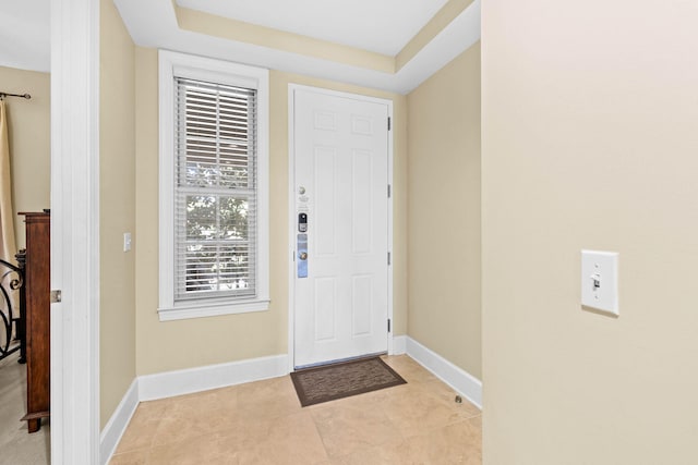 foyer entrance with light tile patterned flooring