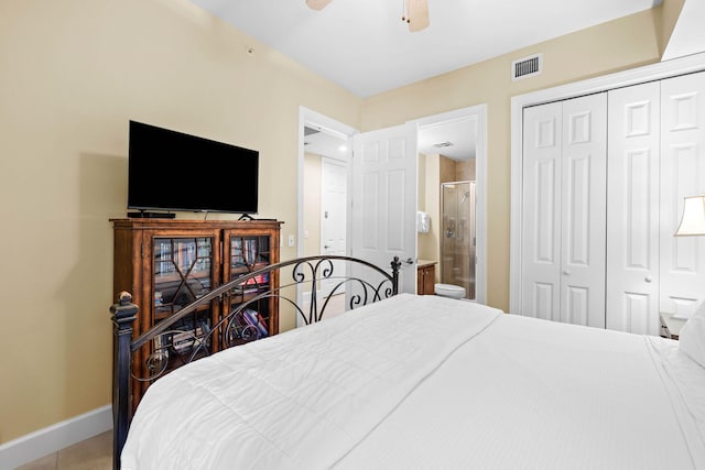 bedroom with ceiling fan, ensuite bath, a closet, and tile patterned floors