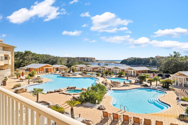 view of pool featuring a patio area and a community hot tub