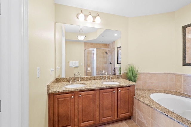 bathroom with vanity, tile patterned floors, and independent shower and bath