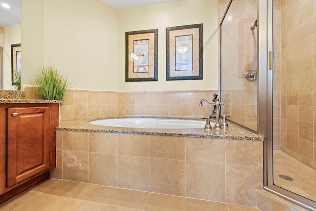 bathroom with vanity, separate shower and tub, and tile patterned flooring