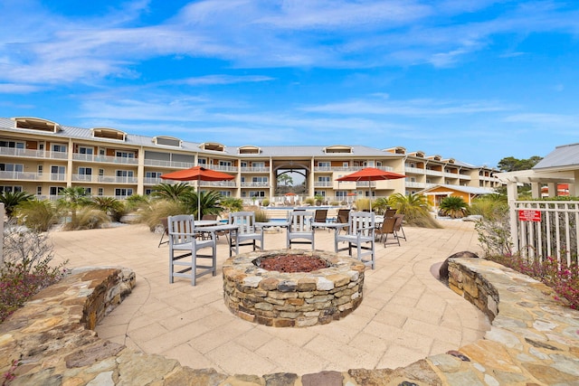 view of patio / terrace featuring an outdoor fire pit