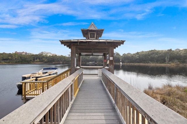 view of dock featuring a water view and a gazebo