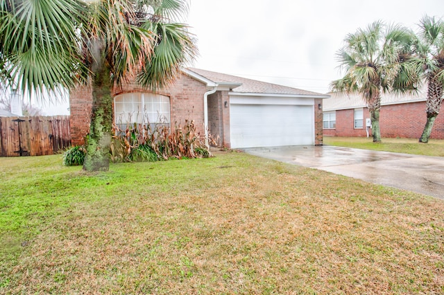 view of front of house with a front lawn and a garage