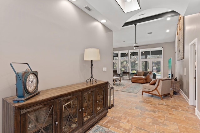 interior space featuring ceiling fan and beam ceiling