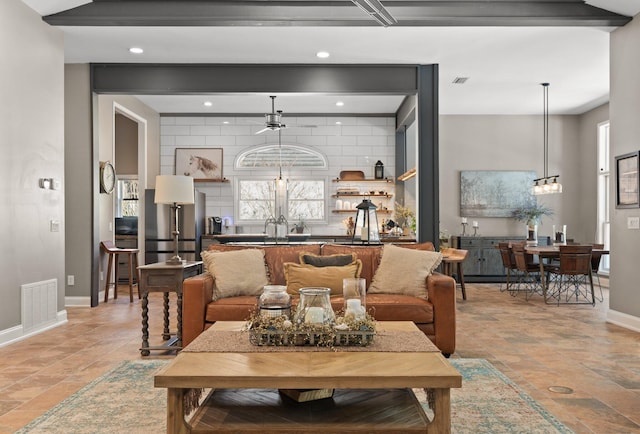 living room with an inviting chandelier