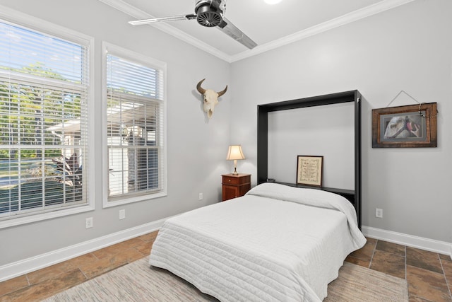 bedroom with ceiling fan and ornamental molding