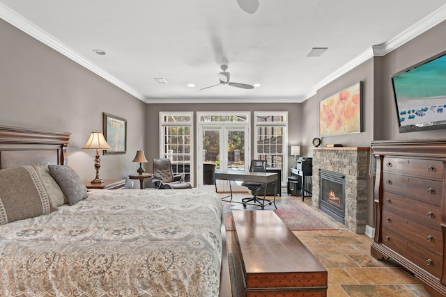 bedroom featuring crown molding, a stone fireplace, ceiling fan, and french doors