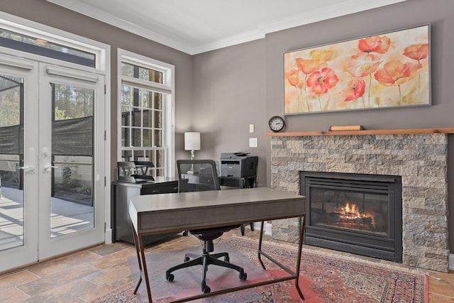 office featuring crown molding, a healthy amount of sunlight, a fireplace, and french doors