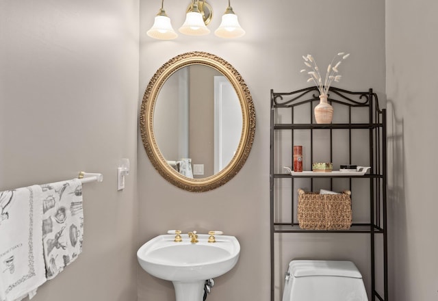 bathroom featuring toilet and sink