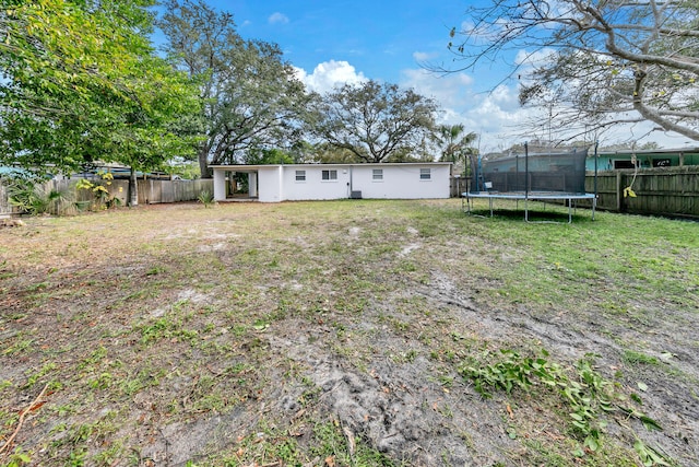 view of yard with a trampoline