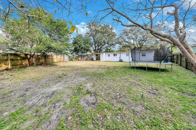 view of yard featuring a trampoline