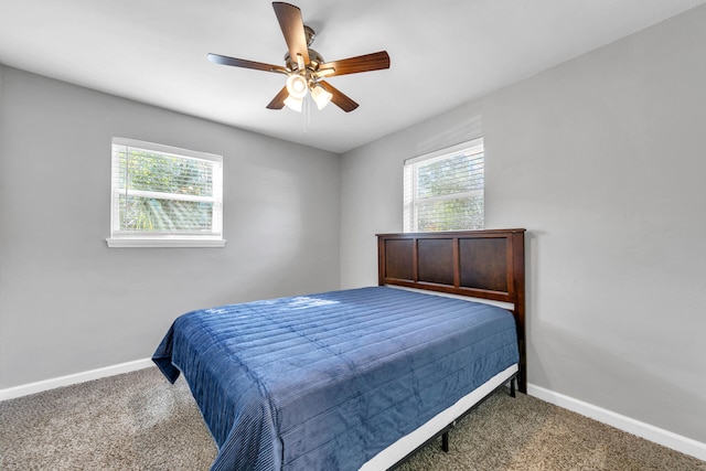 bedroom featuring ceiling fan and carpet