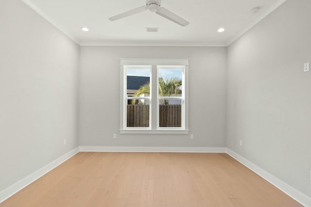 unfurnished room featuring ceiling fan, ornamental molding, and light hardwood / wood-style floors