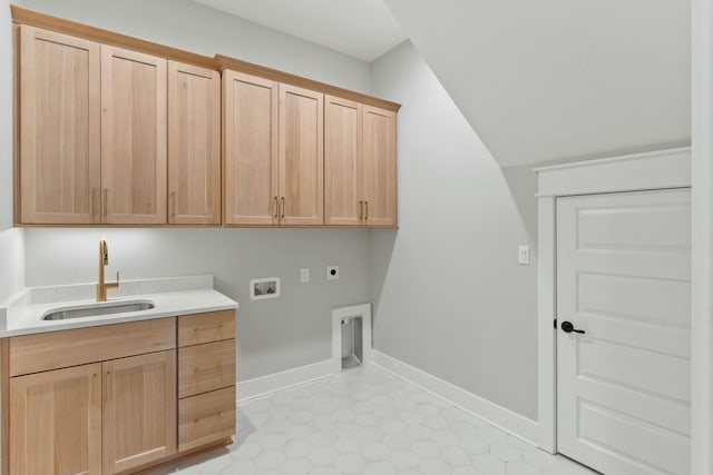 washroom featuring sink, hookup for a washing machine, electric dryer hookup, and cabinets