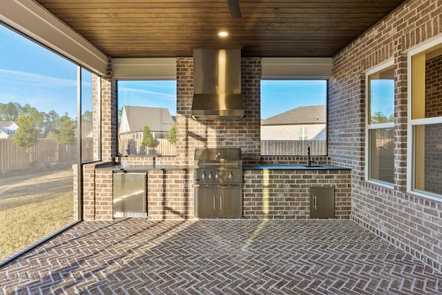 view of patio / terrace featuring an outdoor kitchen, area for grilling, and sink