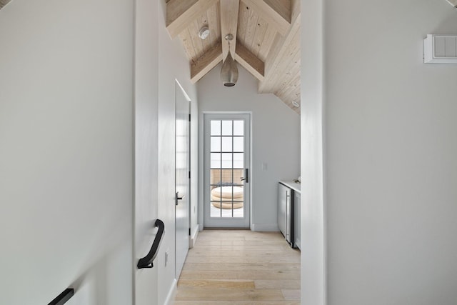 entryway featuring light wood-type flooring, wood ceiling, and lofted ceiling with beams