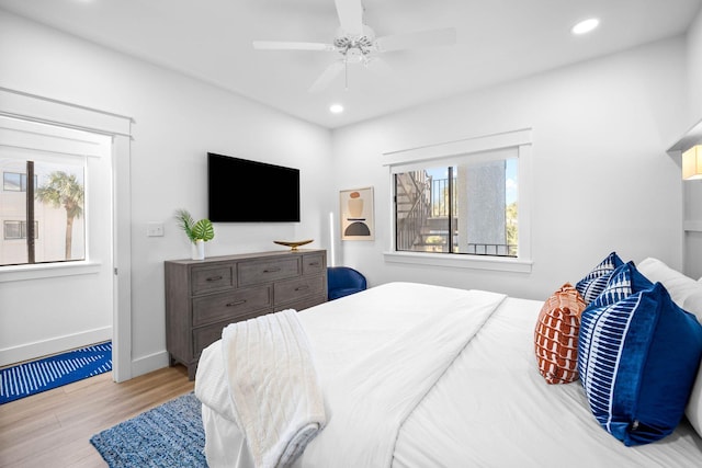 bedroom featuring ceiling fan and light hardwood / wood-style floors