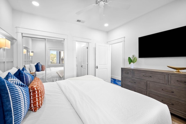 bedroom featuring ceiling fan and a closet