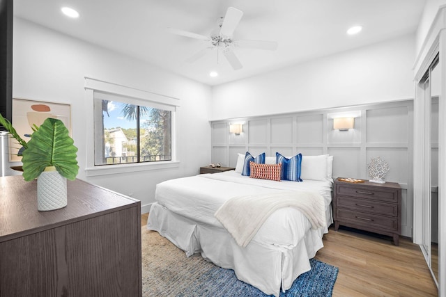 bedroom featuring light wood-type flooring and ceiling fan