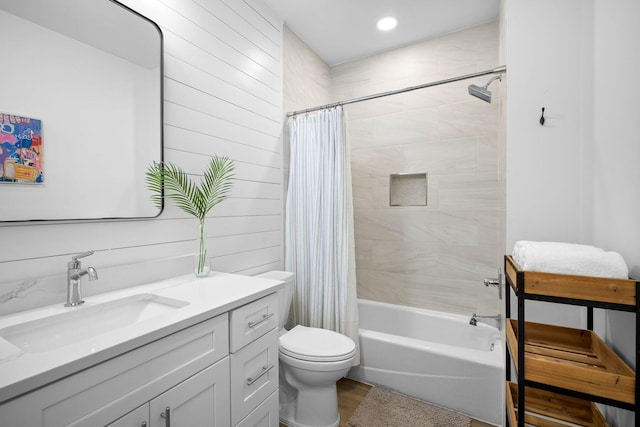 full bathroom with toilet, vanity, shower / tub combo with curtain, and hardwood / wood-style floors