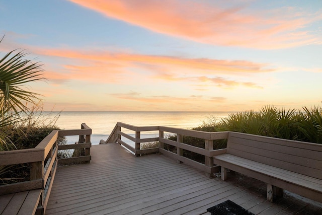 dock area featuring a deck with water view