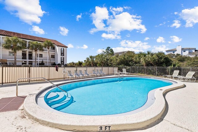 view of swimming pool with a patio