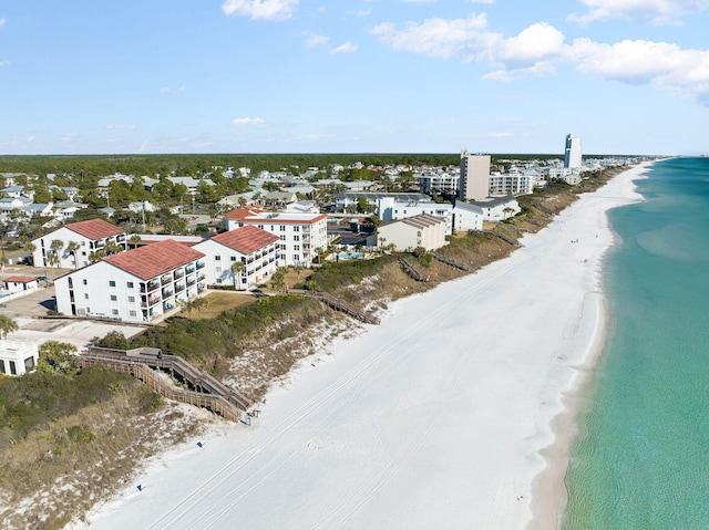 bird's eye view featuring a view of the beach and a water view