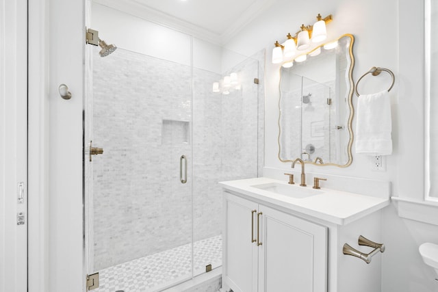 bathroom with a shower with shower door, vanity, toilet, and ornamental molding