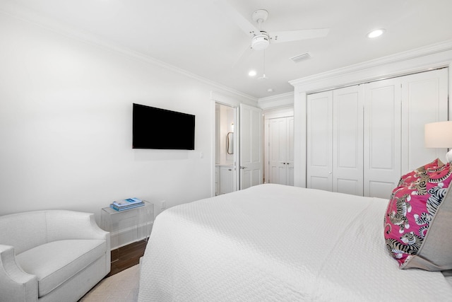 bedroom featuring ceiling fan, crown molding, and hardwood / wood-style flooring