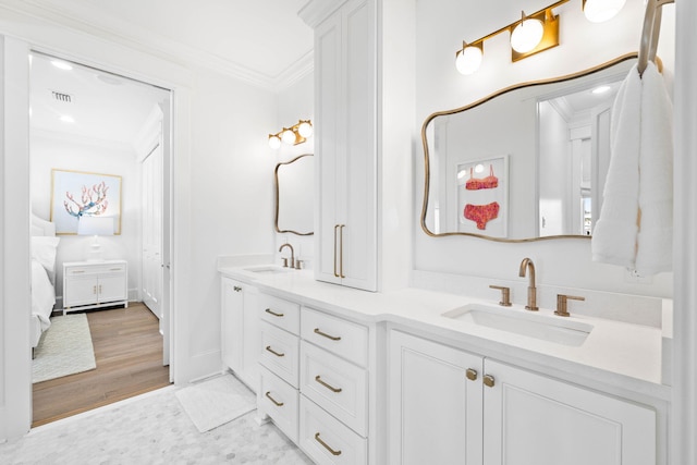 bathroom with vanity and crown molding