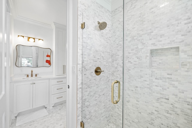 bathroom featuring vanity, crown molding, and an enclosed shower