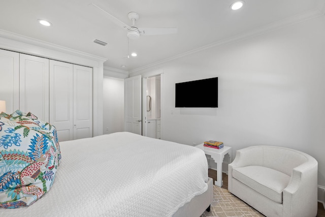 bedroom with ceiling fan, a closet, and crown molding